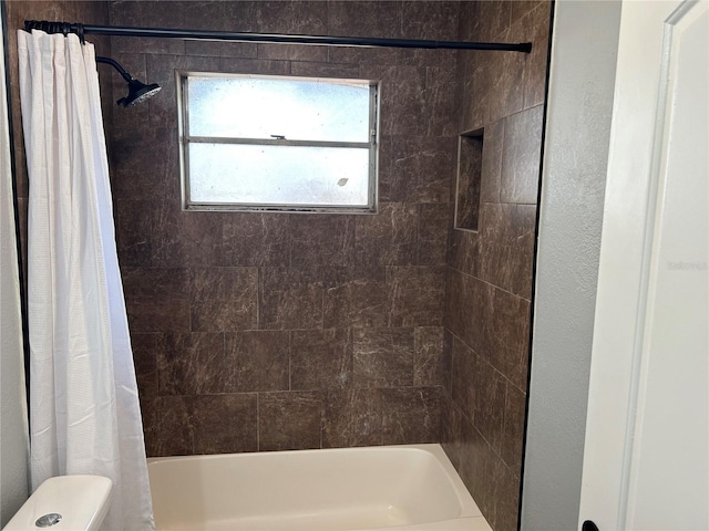 bathroom with shower / bathtub combination with curtain