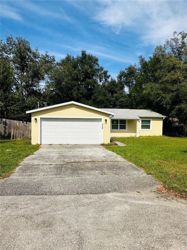 ranch-style home with a front lawn and a garage