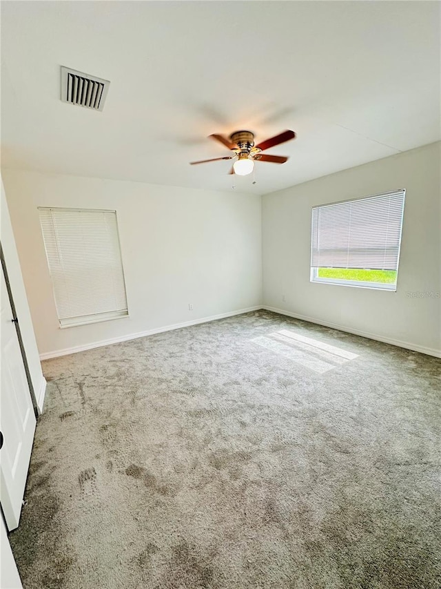 unfurnished room featuring carpet flooring and ceiling fan