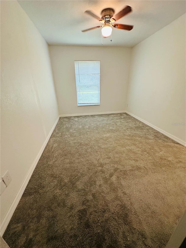 empty room with carpet flooring and ceiling fan