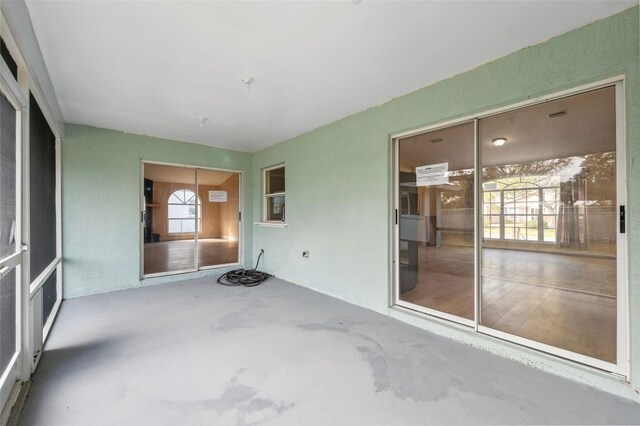 unfurnished sunroom featuring a healthy amount of sunlight