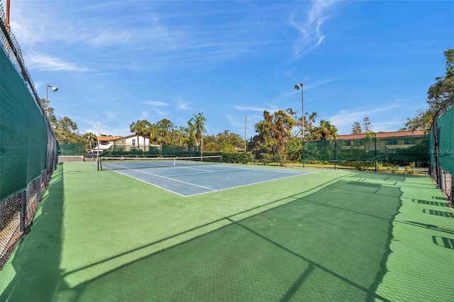 view of sport court featuring basketball hoop