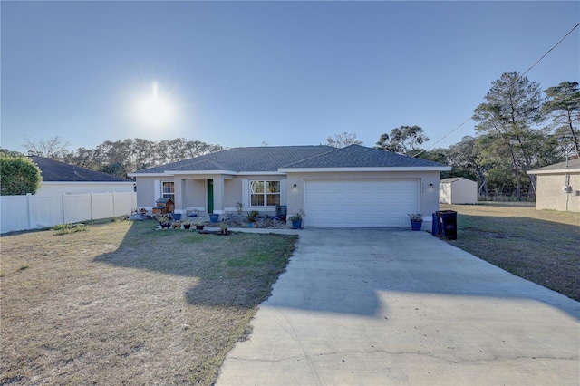 ranch-style home featuring a garage and a front lawn