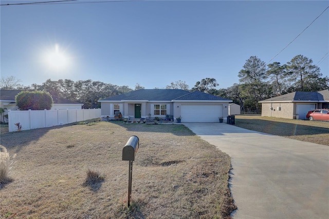 ranch-style home with a garage and a front yard