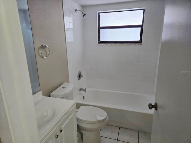 full bathroom with tile patterned floors, toilet, vanity, and tiled shower / bath