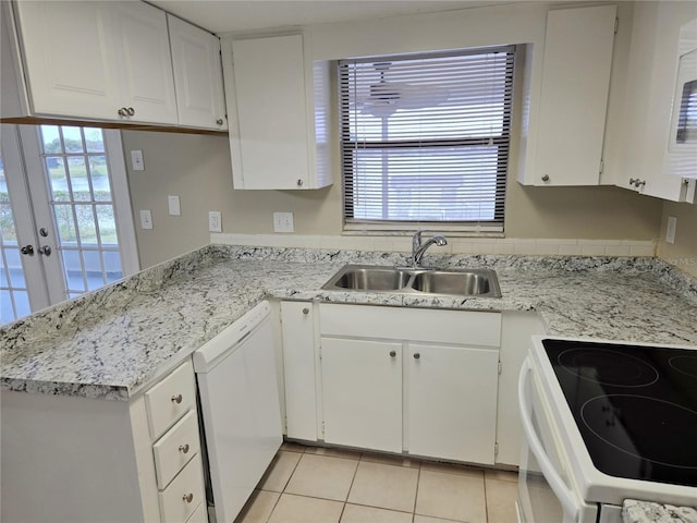 kitchen with white cabinetry, dishwasher, french doors, sink, and range