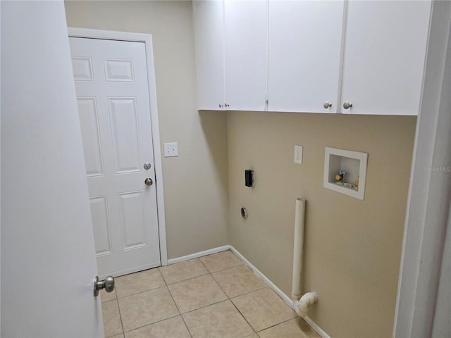 clothes washing area with hookup for an electric dryer, light tile patterned floors, hookup for a washing machine, and cabinets