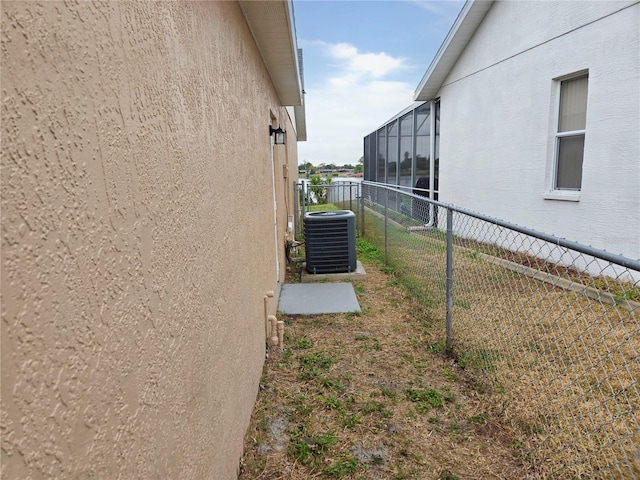 view of side of home featuring cooling unit