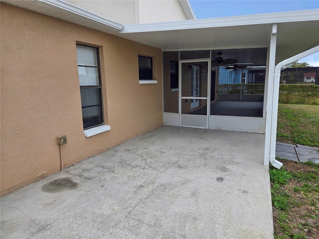 view of patio with a sunroom