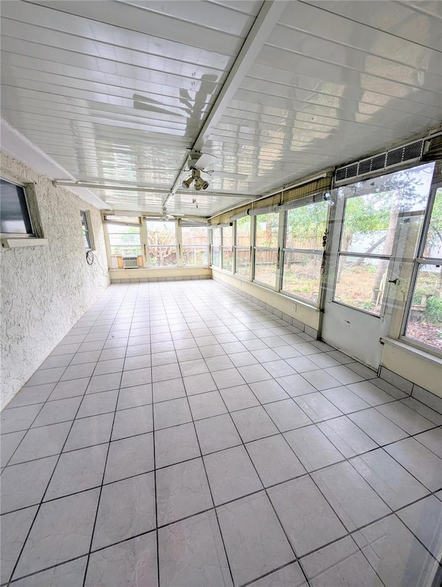 unfurnished sunroom featuring plenty of natural light