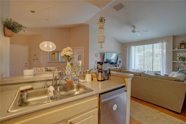 kitchen with ceiling fan, dishwasher, sink, light hardwood / wood-style floors, and vaulted ceiling