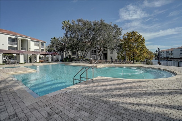 view of swimming pool featuring a patio area