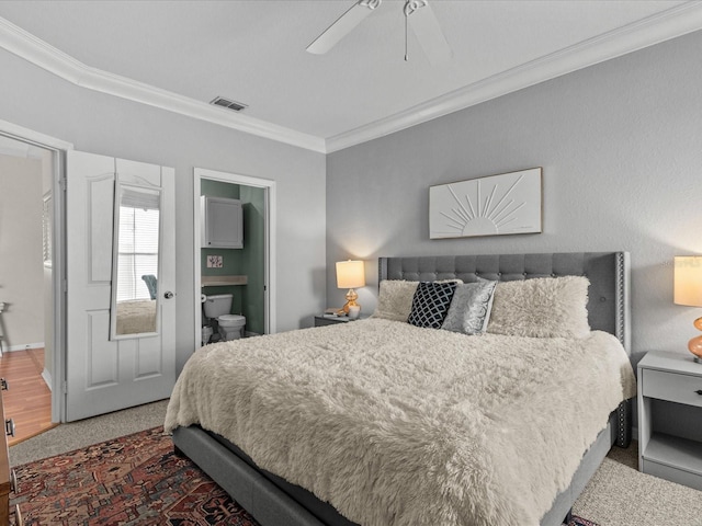 bedroom with ceiling fan, ornamental molding, ensuite bath, and visible vents