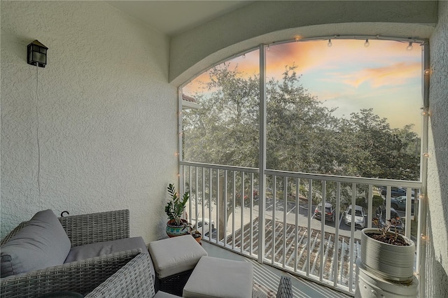 view of balcony at dusk