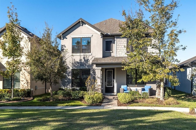 view of front of property featuring a front lawn