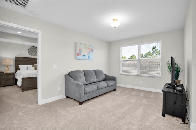 living area with light colored carpet