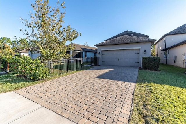 view of front of home featuring a front lawn and a garage