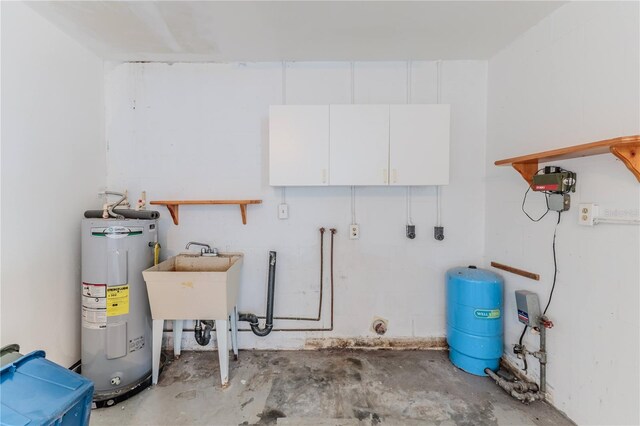 utility room featuring water heater