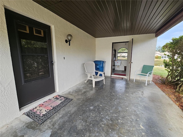 9163 Lingrove Rd, Weeki Wachee, FL 34613 - property entrance featuring stucco siding