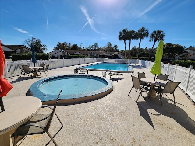 view of pool featuring a patio