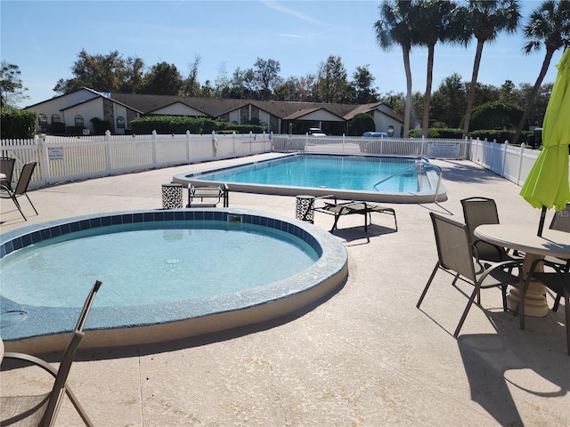 view of swimming pool featuring a patio area