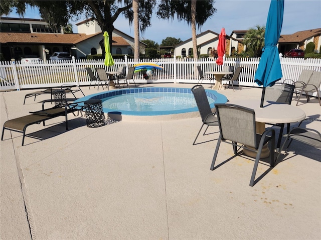 9163 Lingrove Rd, Weeki Wachee, FL 34613 - community pool with a patio area