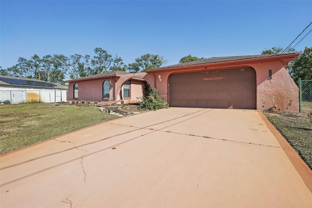 view of front of house featuring a garage and a front yard