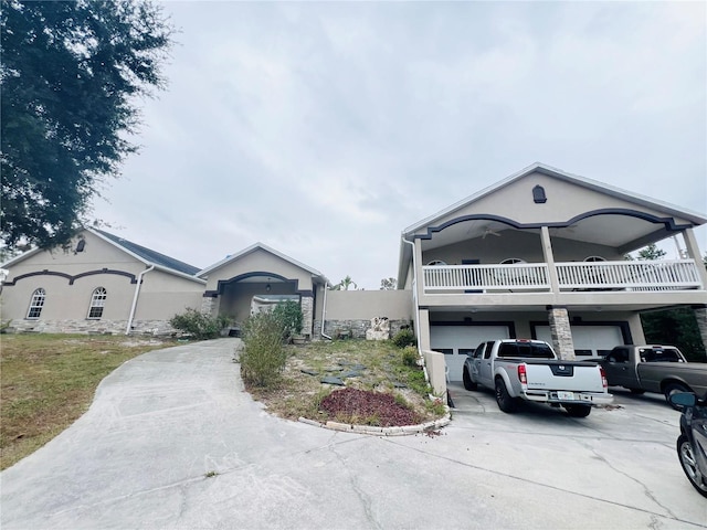 view of front facade with a balcony and a garage