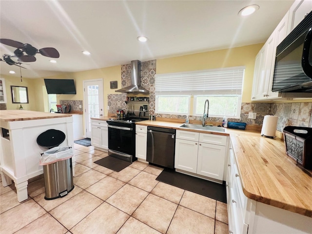 kitchen featuring range with electric cooktop, dishwasher, wall chimney exhaust hood, sink, and butcher block countertops