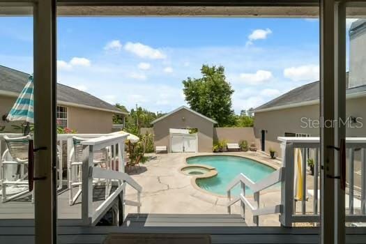 7941 Sycamore Dr, New Port Richey, FL 34654 - view of swimming pool with a patio area