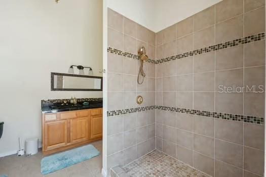 7941 Sycamore Dr, New Port Richey, FL 34654 - bathroom featuring tiled shower and vanity