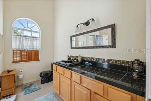 7941 Sycamore Dr, New Port Richey, FL 34654 - bathroom with tile patterned flooring and vanity