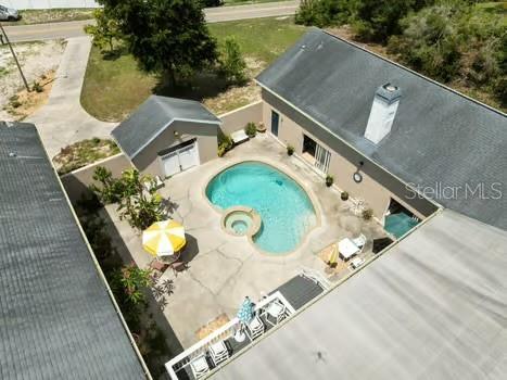 7941 Sycamore Dr, New Port Richey, FL 34654 - view from above of property featuring a pool area