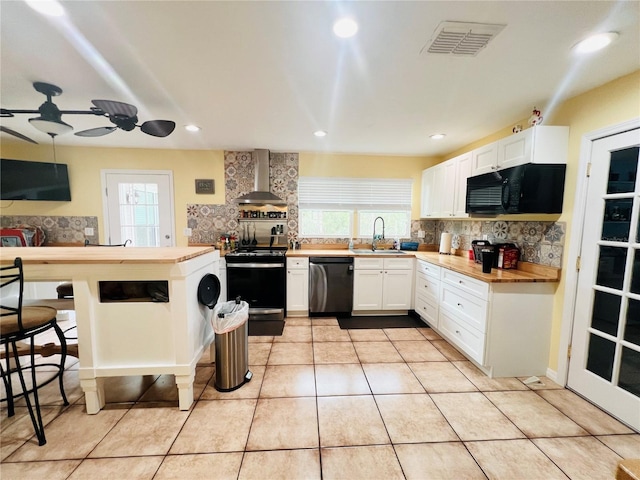 7941 Sycamore Dr, New Port Richey, FL 34654 - kitchen featuring stainless steel appliances, wall chimney exhaust hood, decorative backsplash, plenty of natural light, and recessed lighting