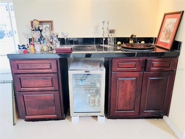 7941 Sycamore Dr, New Port Richey, FL 34654 - indoor bar with beverage cooler and light carpet