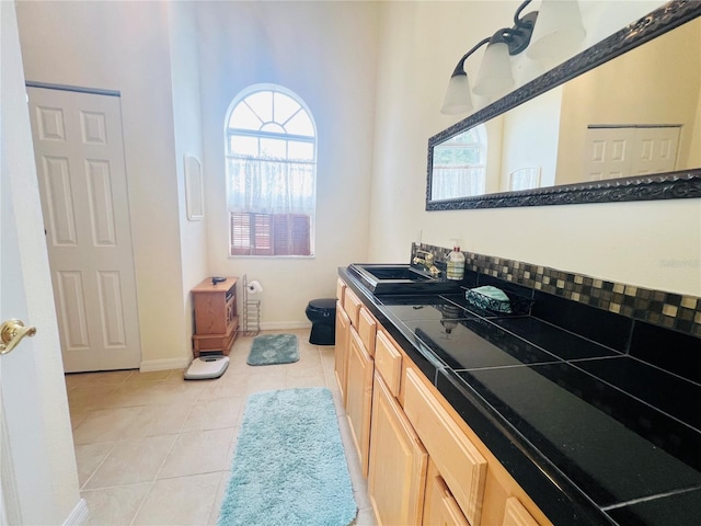 7941 Sycamore Dr, New Port Richey, FL 34654 - bathroom featuring tile patterned floors and vanity