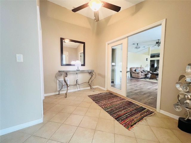 7941 Sycamore Dr, New Port Richey, FL 34654 - doorway to outside with a ceiling fan and tile patterned floors