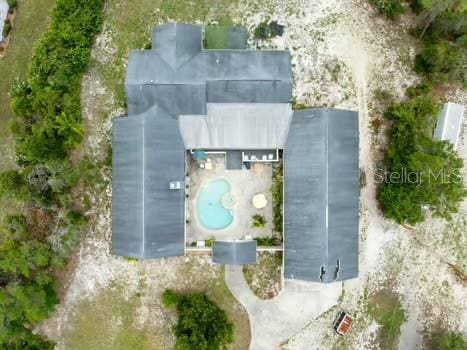 7941 Sycamore Dr, New Port Richey, FL 34654 - drone / aerial view of a pool area