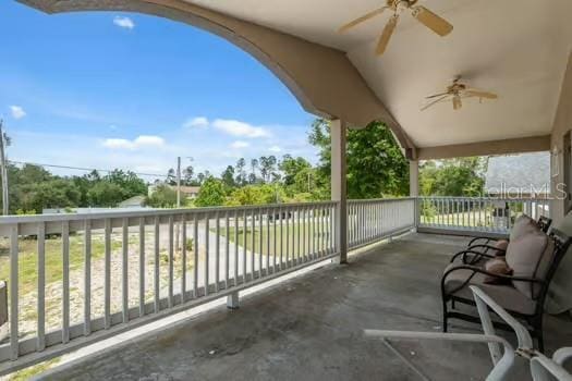 7941 Sycamore Dr, New Port Richey, FL 34654 - patio / terrace featuring a ceiling fan