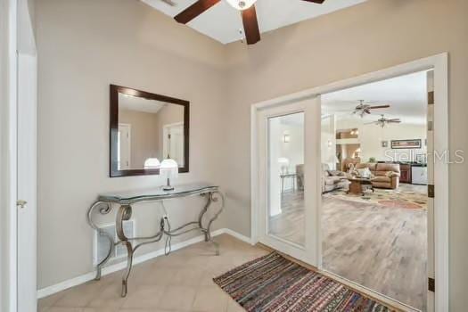 7941 Sycamore Dr, New Port Richey, FL 34654 - doorway featuring a ceiling fan and baseboards