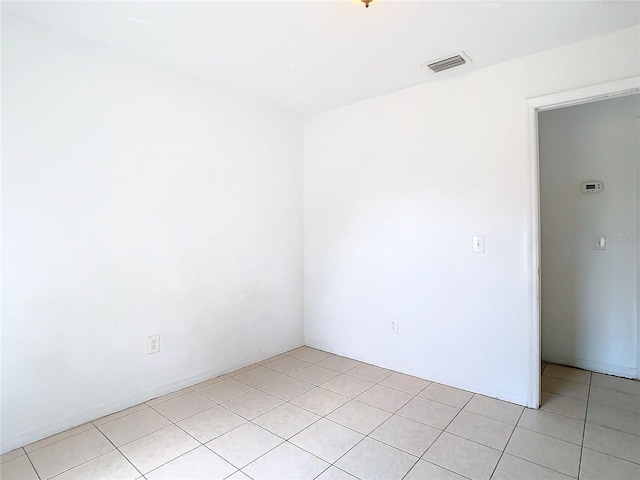 empty room with light tile patterned flooring