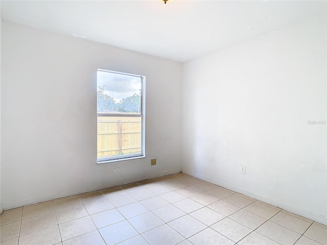 empty room with light tile patterned floors