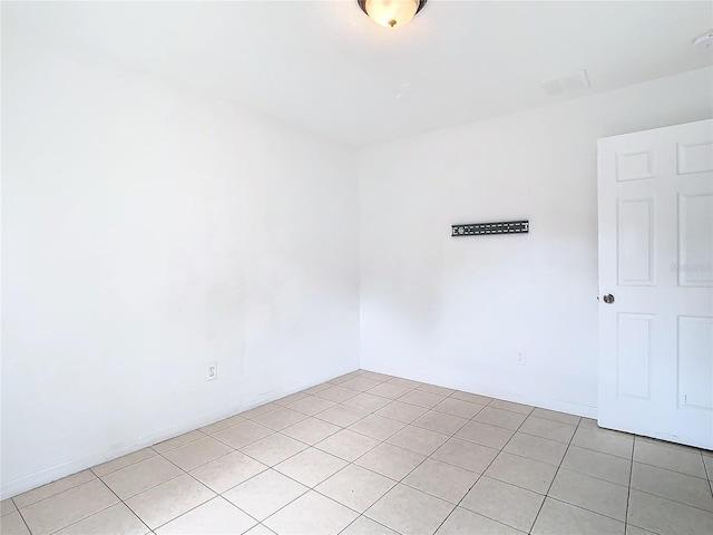 unfurnished room with light tile patterned floors