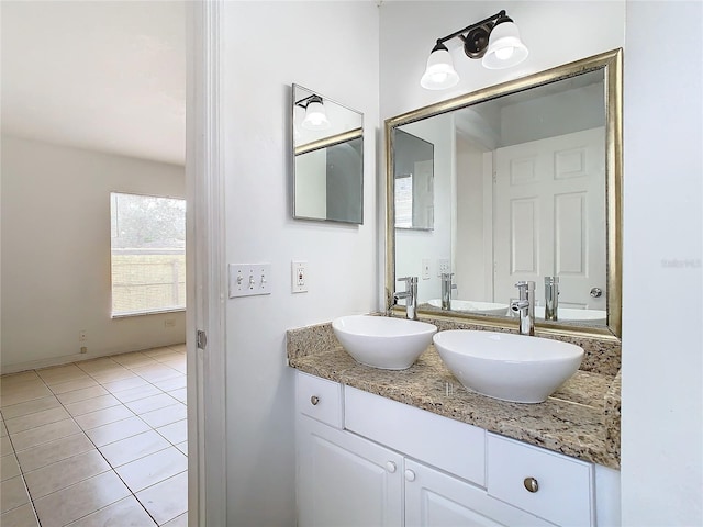 bathroom with tile patterned flooring and vanity