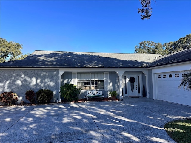 ranch-style home with a garage