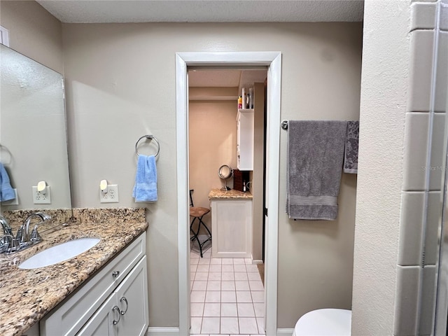 bathroom featuring tile patterned floors and vanity