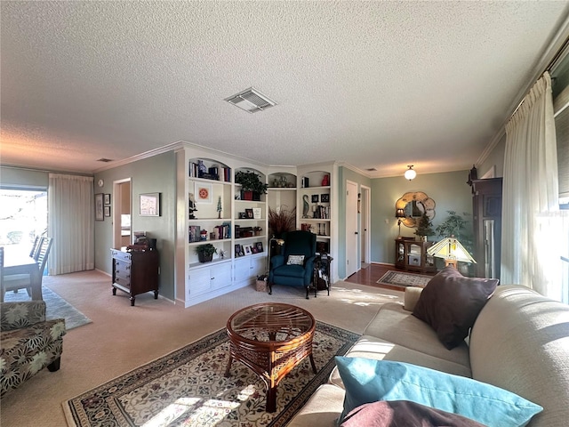 carpeted living room with a textured ceiling and crown molding