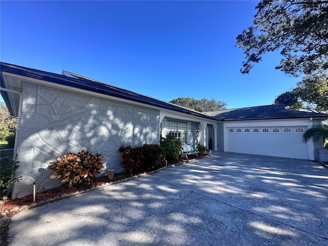 single story home featuring a garage