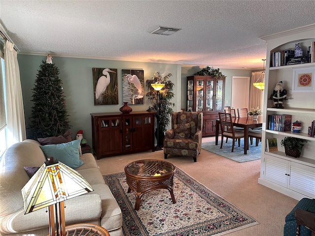 living room with light colored carpet, ornamental molding, and a textured ceiling