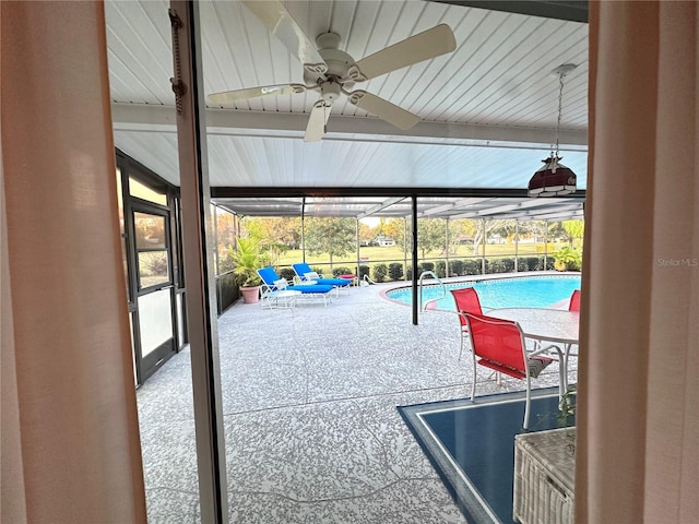 view of pool featuring ceiling fan